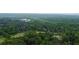 Expansive aerial view showcasing lush woodland area at 716 Counsel Ne Dr, Marietta, GA 30068