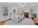 Bright bedroom featuring hardwood floors, a ceiling fan, and great natural light at 716 Counsel Ne Dr, Marietta, GA 30068