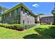 Lawn view of a stone house featuring several windows, and a well-manicured lawn at 716 Counsel Ne Dr, Marietta, GA 30068