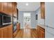 Modern kitchen featuring stainless steel appliances, hardwood flooring, and access to the breakfast nook at 716 Counsel Ne Dr, Marietta, GA 30068