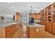 Expansive kitchen with wood cabinets, central island cooktop, modern appliances, and hardwood flooring at 716 Counsel Ne Dr, Marietta, GA 30068