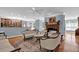 Elegant living room featuring hardwood floors, a fireplace, and seamless access to the kitchen at 716 Counsel Ne Dr, Marietta, GA 30068