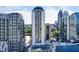 Stunning aerial view of high-rise buildings, city skyline, and a visible tennis court on top of a building at 1280 W Peachtree St Nw # 3208, Atlanta, GA 30309