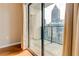 Balcony view featuring curtains and a tall building in the distance at 1280 W Peachtree St Nw # 3208, Atlanta, GA 30309