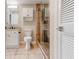 Bathroom featuring modern vanity, toilet and glass shower with decorative mosaic tiling at 1280 W Peachtree St Nw # 3208, Atlanta, GA 30309