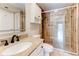 Bathroom with a large stone-tiled shower, granite vanity top, and modern fixtures at 1280 W Peachtree St Nw # 3208, Atlanta, GA 30309