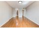 Empty bedroom offering ample space, hardwood floors, and a modern, neutral color palette at 1280 W Peachtree St Nw # 3208, Atlanta, GA 30309