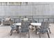 Outdoor grilling area with tables, chairs, and modern grills for residents' enjoyment at 1280 W Peachtree St Nw # 3208, Atlanta, GA 30309