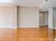 Open-concept living room with hardwood flooring and neutral paint, creating a modern feel with recessed lighting at 1280 W Peachtree St Nw # 3208, Atlanta, GA 30309