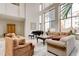 Elegant living room featuring a piano and plenty of seating at 1280 W Peachtree St Nw # 3208, Atlanta, GA 30309