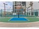 Outdoor tennis and basketball courts with green fencing at 1280 W Peachtree St Nw # 3208, Atlanta, GA 30309