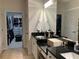 Bathroom featuring double sinks, a large mirror, and access to the walk-in closet at 3311 Lindenridge Dr, Buford, GA 30519