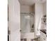 Bright bathroom with a shower-over-tub, toilet, sink, and a chrome finish shower head at 3311 Lindenridge Dr, Buford, GA 30519