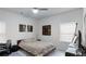 Neutral-toned bedroom with a ceiling fan, a bed, and a desk workstation at 3311 Lindenridge Dr, Buford, GA 30519