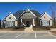 Exterior of community clubhouse showcasing well-manicured landscaping and architecture at 3311 Lindenridge Dr, Buford, GA 30519