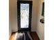 Elegant black front door with decorative wrought iron design and sidelight at 3311 Lindenridge Dr, Buford, GA 30519