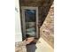 A decorative glass door with stone accents, providing an elegant entryway to the home at 3311 Lindenridge Dr, Buford, GA 30519