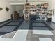 Organized garage with epoxy floor, utility sink, wall shelving, tool box and storage for parking two cars at 3311 Lindenridge Dr, Buford, GA 30519