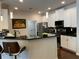 Well-lit kitchen featuring white cabinets, dark countertops and stainless steel appliances at 3311 Lindenridge Dr, Buford, GA 30519