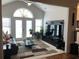 Bright living room with large windows, high ceilings, and comfortable seating arrangement at 3311 Lindenridge Dr, Buford, GA 30519