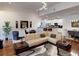Open concept living room with stylish sofa, kitchen view, and modern decor at 3311 Lindenridge Dr, Buford, GA 30519