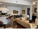 Open layout showing the kitchen, living, and dining areas with modern decor and lighting at 3311 Lindenridge Dr, Buford, GA 30519