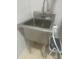 Utility sink with stainless steel finish and chrome faucet at 3311 Lindenridge Dr, Buford, GA 30519