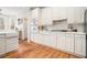 Kitchen with white cabinets, tile backsplash, and stainless steel appliances at 3740 Cannonwolde Dr, Snellville, GA 30039