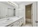 Bright bathroom with double sink vanity, white cabinets, and a shower-tub combo at 6272 Cheatham Lake Nw Dr, Acworth, GA 30101