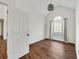 An empty bedroom with wood-look flooring, a ceiling fan, and a window at 6272 Cheatham Lake Nw Dr, Acworth, GA 30101