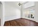 Dining room with large windows, hardwood floors, and chair rail at 6272 Cheatham Lake Nw Dr, Acworth, GA 30101