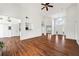 Open-concept living room featuring hardwood floors, high ceilings, and natural light at 6272 Cheatham Lake Nw Dr, Acworth, GA 30101