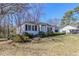 Cozy single-story home with manicured front bushes and a well-maintained lawn at 8523 Duncan St, Douglasville, GA 30134