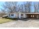 Exterior of home featuring attached covered parking and front yard landscaping at 8523 Duncan St, Douglasville, GA 30134