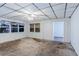 Living room with large windows, paneling, and a ceiling fan at 8523 Duncan St, Douglasville, GA 30134