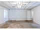 Living room with large windows, paneling, and a ceiling fan at 8523 Duncan St, Douglasville, GA 30134