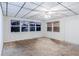 Living room with large windows, paneling, and a ceiling fan at 8523 Duncan St, Douglasville, GA 30134