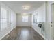 Bright living room features wood flooring, with natural light from the windows at 8523 Duncan St, Douglasville, GA 30134