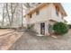 Back exterior of home with door leading to backyard and lawn at 123 Creek Cir, Stockbridge, GA 30281