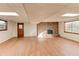 Finished basement featuring wood-look flooring, a brick fireplace, and natural light at 123 Creek Cir, Stockbridge, GA 30281