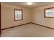 Bedroom with neutral carpet, two windows offering natural light at 123 Creek Cir, Stockbridge, GA 30281