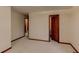 Bedroom with neutral carpet with trim detail and view into other rooms at 123 Creek Cir, Stockbridge, GA 30281