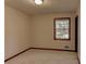 Bedroom with neutral walls and carpet, trim detail, and natural light from a window at 123 Creek Cir, Stockbridge, GA 30281