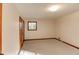 Spacious bedroom featuring neutral walls and carpet with a window providing natural light at 123 Creek Cir, Stockbridge, GA 30281