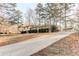 A beautiful suburban home, featuring a long driveway and mature trees at 123 Creek Cir, Stockbridge, GA 30281