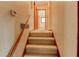 Carpeted stairway and hallway with view into rooms, creating a warm and inviting atmosphere at 123 Creek Cir, Stockbridge, GA 30281
