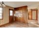 Bright kitchen with wood-look floors, cabinetry, and a view into another room at 123 Creek Cir, Stockbridge, GA 30281