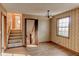 Spacious living room with patterned wallpaper, stairs to another level, and natural light at 123 Creek Cir, Stockbridge, GA 30281