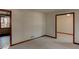 An empty living room exhibiting carpet floors, fresh paint and ample natural light at 123 Creek Cir, Stockbridge, GA 30281