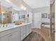 Bright bathroom with dual vanities, shower, and soaking tub at 17 Denny Springs Dr, Dallas, GA 30157